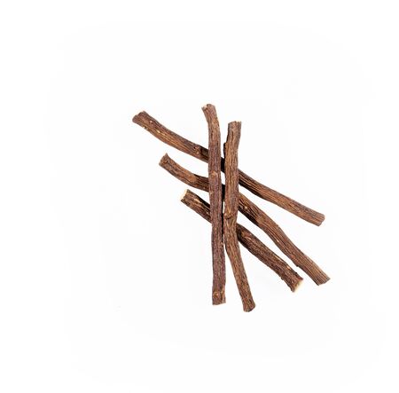 Close up of Ayurvedic herb Liquorice root,Licorice root, Mulethi or Glycyrrhiza glabra root on a wooden surface is very much beneficial for Soothes your stomach,poisoning, stomach ulcersの写真素材