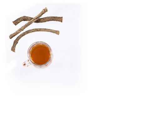 Valeriana officinalis - Valerian twigs and tea. White backgroundの写真素材