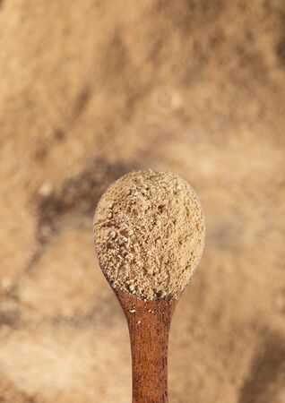 Lepidium meyenii - Maca powder in wooden spoonの写真素材