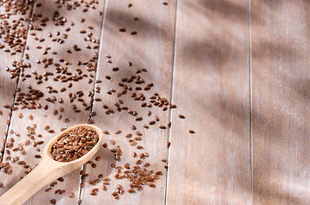 Linum usitatissimum - Whole and crushed flax seedsの写真素材