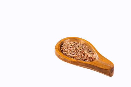 Crushed flax seeds in wooden spoon - Linum usitatissimumの写真素材