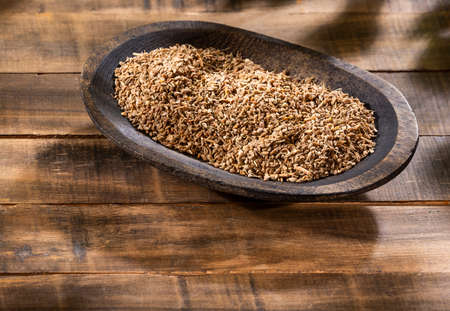 Anise seeds seasoning in a wooden bowl - Pimpinella anisum