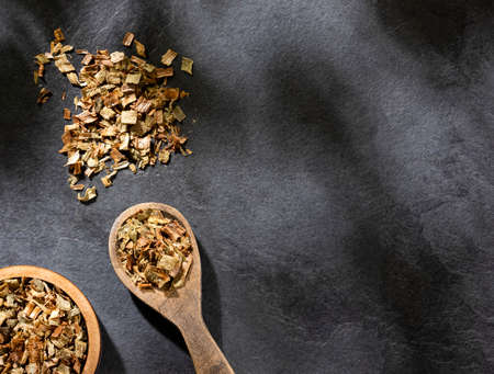 Dried leek in wooden spoon - Allium ampeloprasum var. porrumの写真素材
