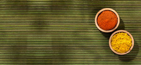 Paprika - curry organic spices in the wooden bowlsの写真素材