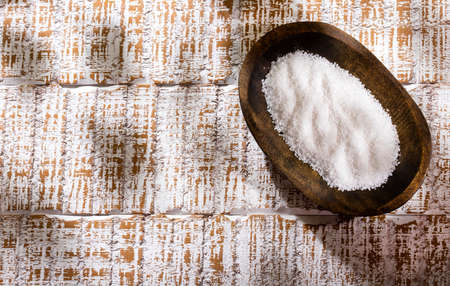 Sea salt crystals in the wooden bowl - Text spaceの写真素材