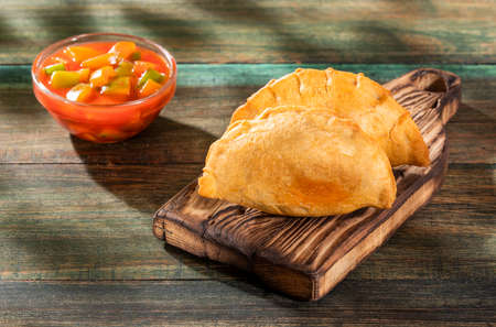Traditional baked Argentinian empanadas savory pastries with meat beef stuffingの写真素材