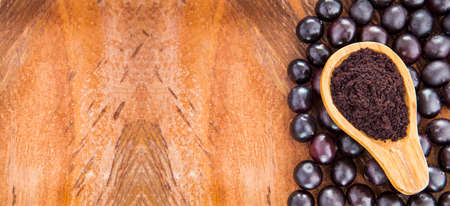 Acai powder and fresh berries from the Amazon - Euterpe oleraceaの写真素材