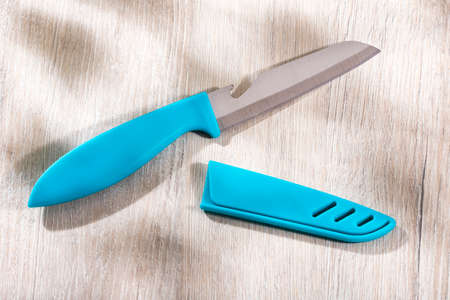 Modern blue kitchen knife and plastic handle, plastic blade guardの写真素材