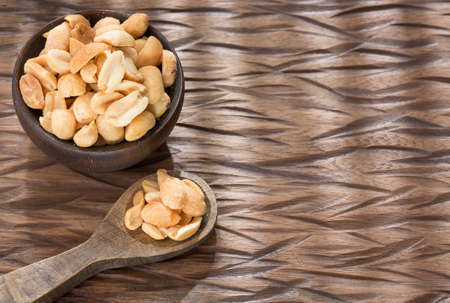 Organic peeled peanuts - Arachis hypogaea. Text space