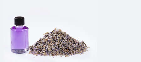 Essential Organic Lavender Oil in Glass Bottle with Dried Flowers - Lavandulaの写真素材