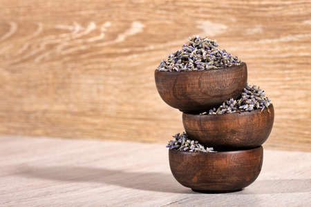 Dried lavender flowers in three wooden bowls - Lavandula.の写真素材