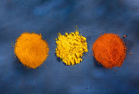 Turmeric, curry and paprika - Heap of spices