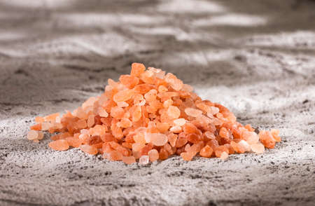 Himalayan pink salt crystals, powdered red rock salt from Pakistanの写真素材