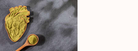 Moringa oleifera - Organic moringa powder in the heart shaped bowlの写真素材