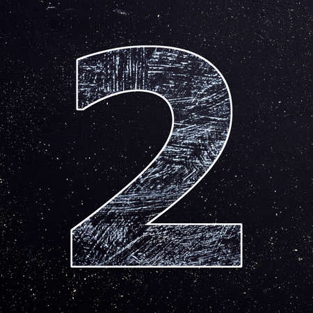 Two - Number written with chalk on the blackboardの写真素材