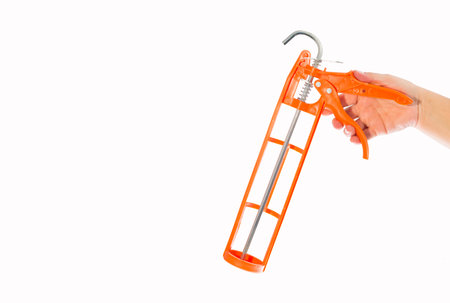 Gun for applying silicone to the hand - Text spaceの写真素材