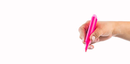 Hand holds pink highlighter - White backgroundの写真素材