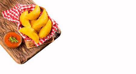 Colombian empanada with spicy sauce - White backgroundの写真素材