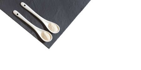 Hydrolyzed collagen protein in two spoons - Text spaceの写真素材