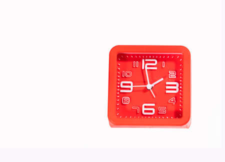 Red alarm clock isolated on white backgroundの写真素材