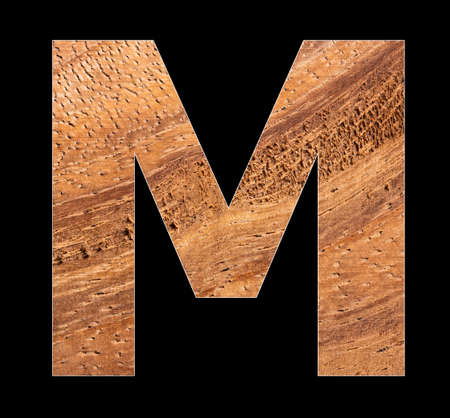 Alphabet letter M on rustic wooden backgroundの写真素材