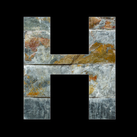 Rustic stone letter H - Black backgroundの写真素材