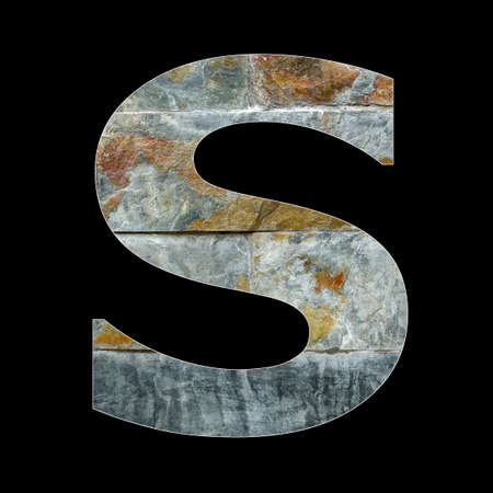 Rustic stone letter S - Black backgroundの写真素材