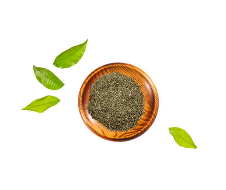 Dried organic tarragon leaves in wooden bowl - Artemisia dracunculusの写真素材