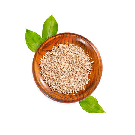 Organic quinoa seeds in wooden bowl - Chenopodium quinoaの写真素材