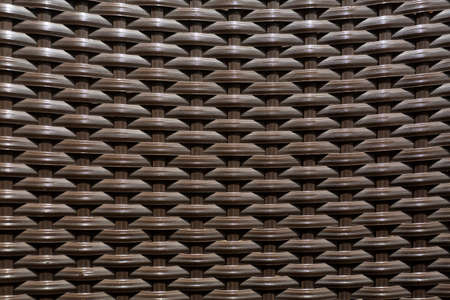 Brown synthetic rattan weave texture - Close-up of plastic weaveの写真素材