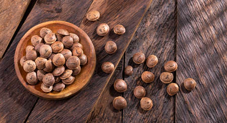 Dried sacha inchi nuts in the bowl - Plukenetia volubilis