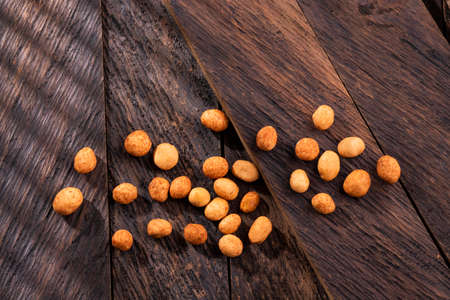 Arachis hypogaea - Organic Japanese peanuts on wooden backgroundの写真素材