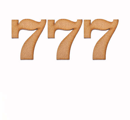 Number 777 in wood, isolated on white backgroundの写真素材