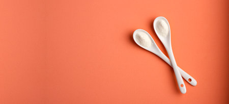 Hydrolyzed collagen powder in two ceramic spoonsの写真素材