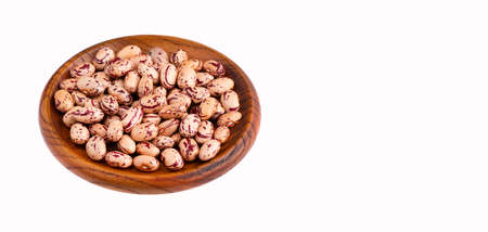 Phaseolus vulgaris - Raw dry pinto beans in wooden bowl