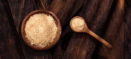Organic sesame seeds in the bowl and spoon - Sesamum indicumの写真素材