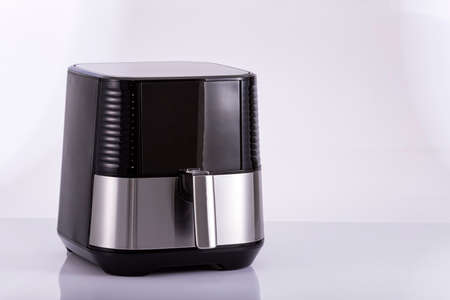 Silver steel digital hot air fryer - neutral backgroundの写真素材