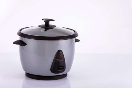 Small electric rice cooker on neutral backgroundの写真素材