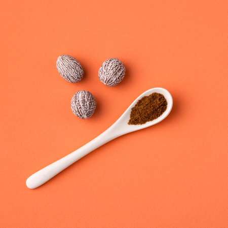 Organic nutmeg powder in spoon - Myristicaの写真素材