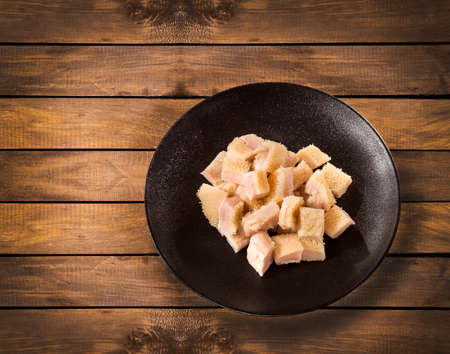 Raw chopped tripe on the plate - wooden backgroundの写真素材