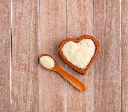 Powdered milk with nutrients in the heart shaped bowl