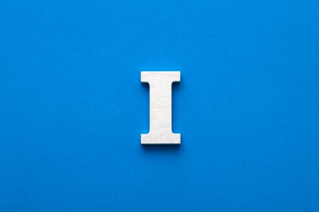 Letter I uppercase - White wood font on blue foamy backgroundの写真素材