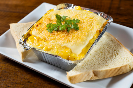 Hot lasagna, served in an aluminum container - Colombian preparation