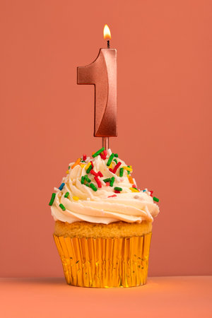 Birthday cake with candle number 1 - Coral fusion backgroundの写真素材
