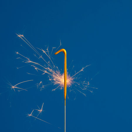 Birthday number 1 of sparks on blue background