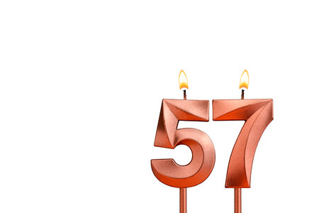 Birthday candle number 57 on white background