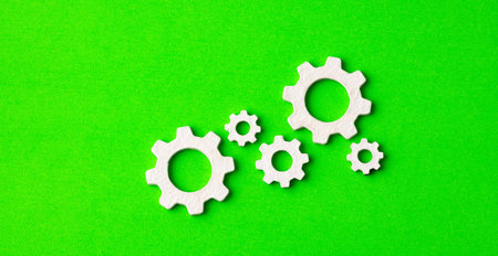 Gears on green background - Business productivity conceptの写真素材