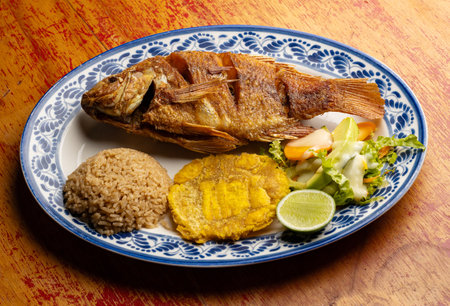 Served dish of fried tilapia fish - Typical Colombian dishの写真素材