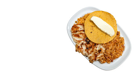 Traditional Colombian breakfast - Grilled chicken, arepa, cheese, fried egg and reheated beans with riceの写真素材