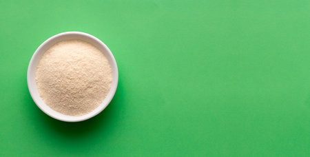 Organic gelatin powder also called hydrolyzed collagen - White powder in the bowlの写真素材